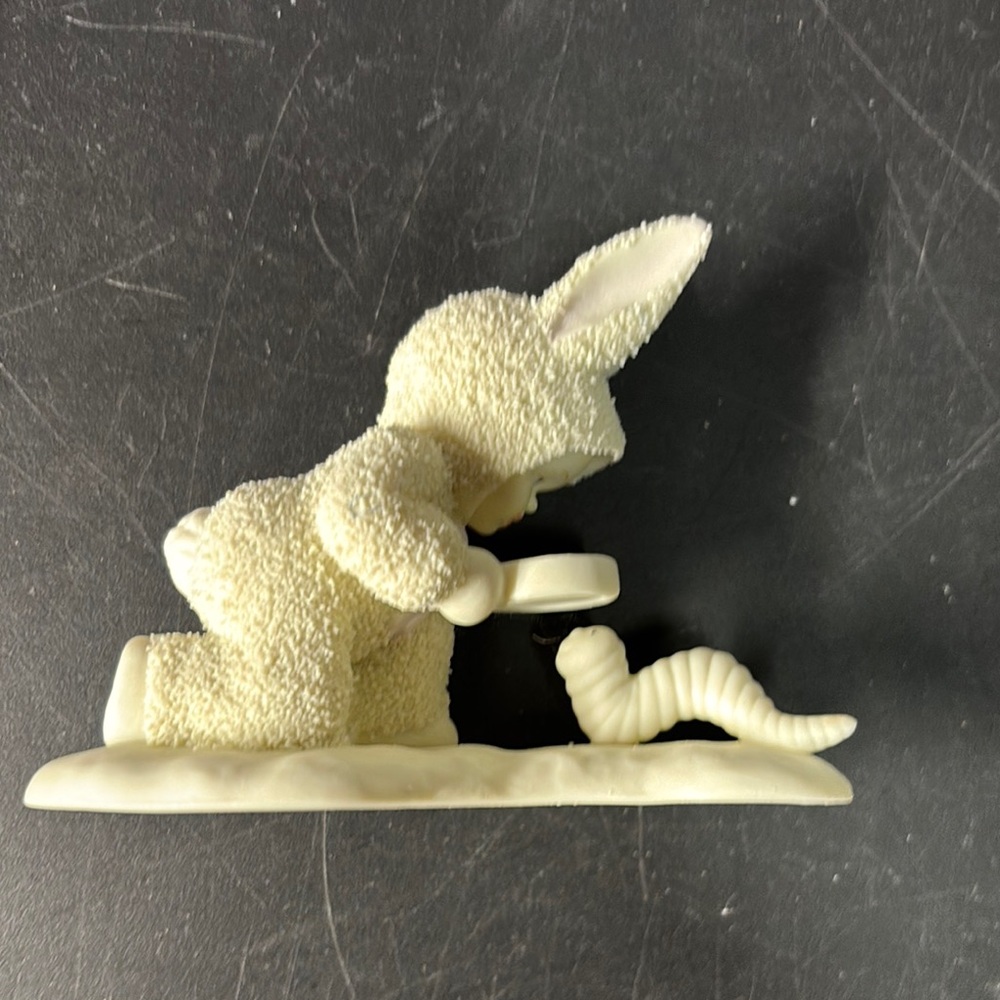 Snow babies Looking at an Inch Worm figurine!